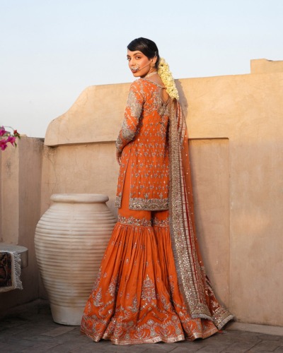 Orange Pakistani Wedding Outfit in Kameez and Gharara - Image 2